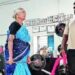 82-year-old Kittammal lifting weights at a powerlifting competition, showcasing her strength and determination.